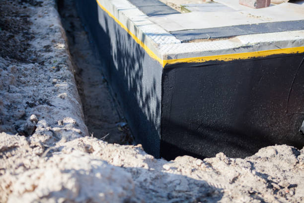 Professional Waterproofing technician working in Bayport, NY